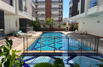 Fully Furnished 1+1 Garden Floor Apartment for Sale in Liman, Konyaaltı (Pool Access)